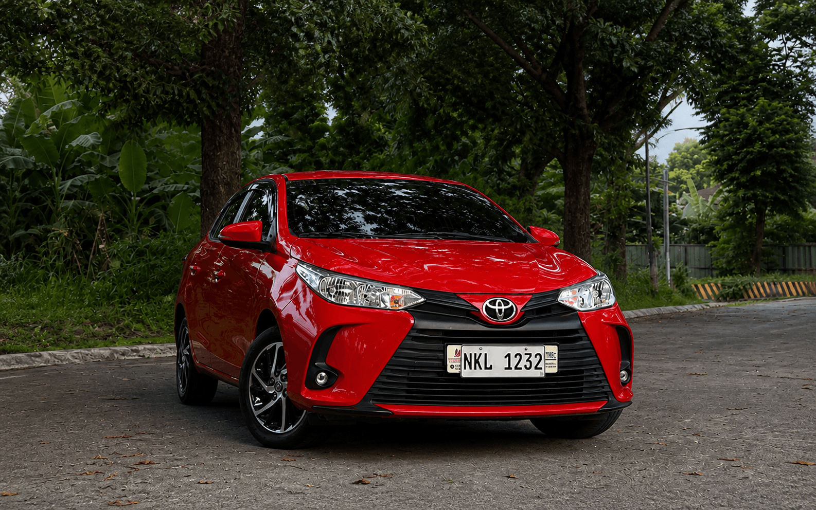 Red Toyota five-seater self-drive car available from CASA CAR RENTALS